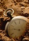 old_pocket_watch_buried_1774093