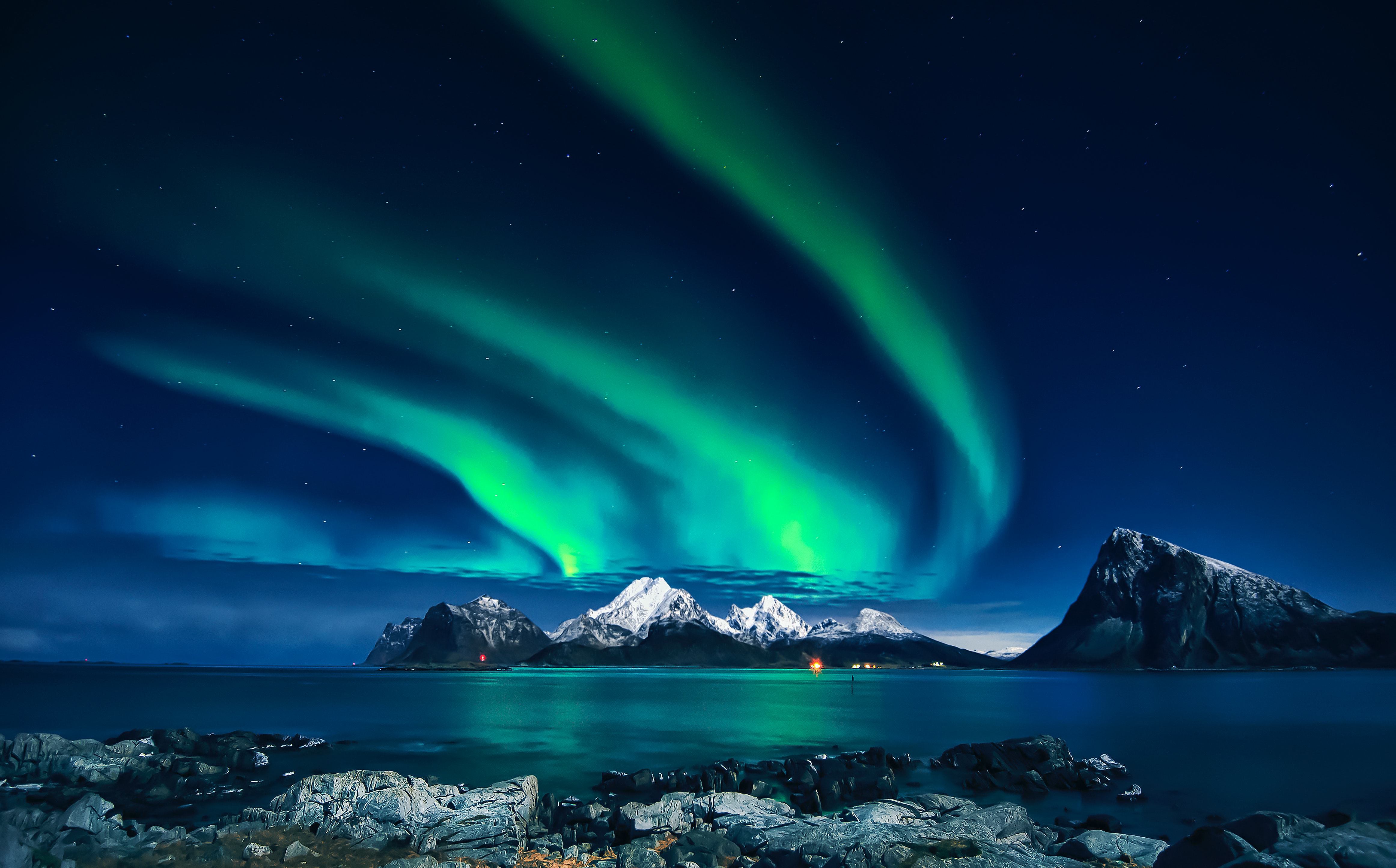 Photo by stein egil liland: https:::www.pexels.com:photo:mountain-under-aurora-borealis-9636388: